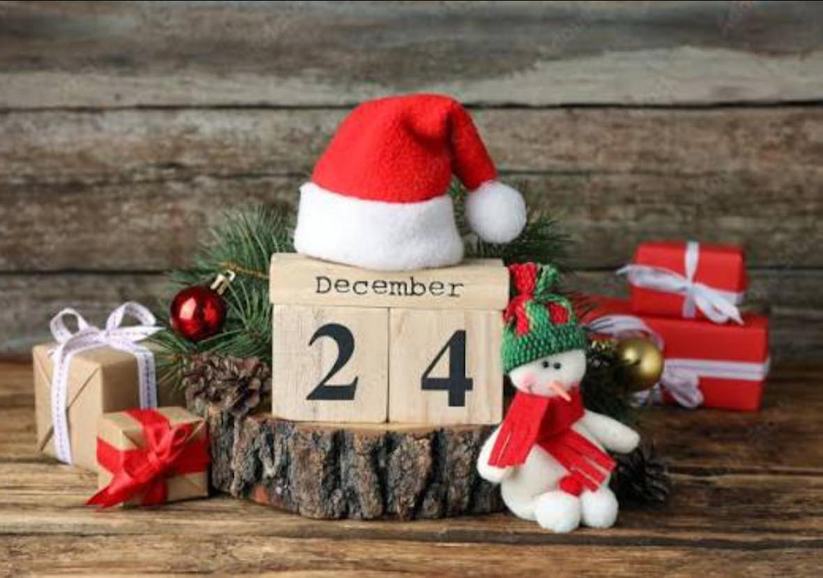 Christmas Eve display with date blocks, gifts, and Santa hat