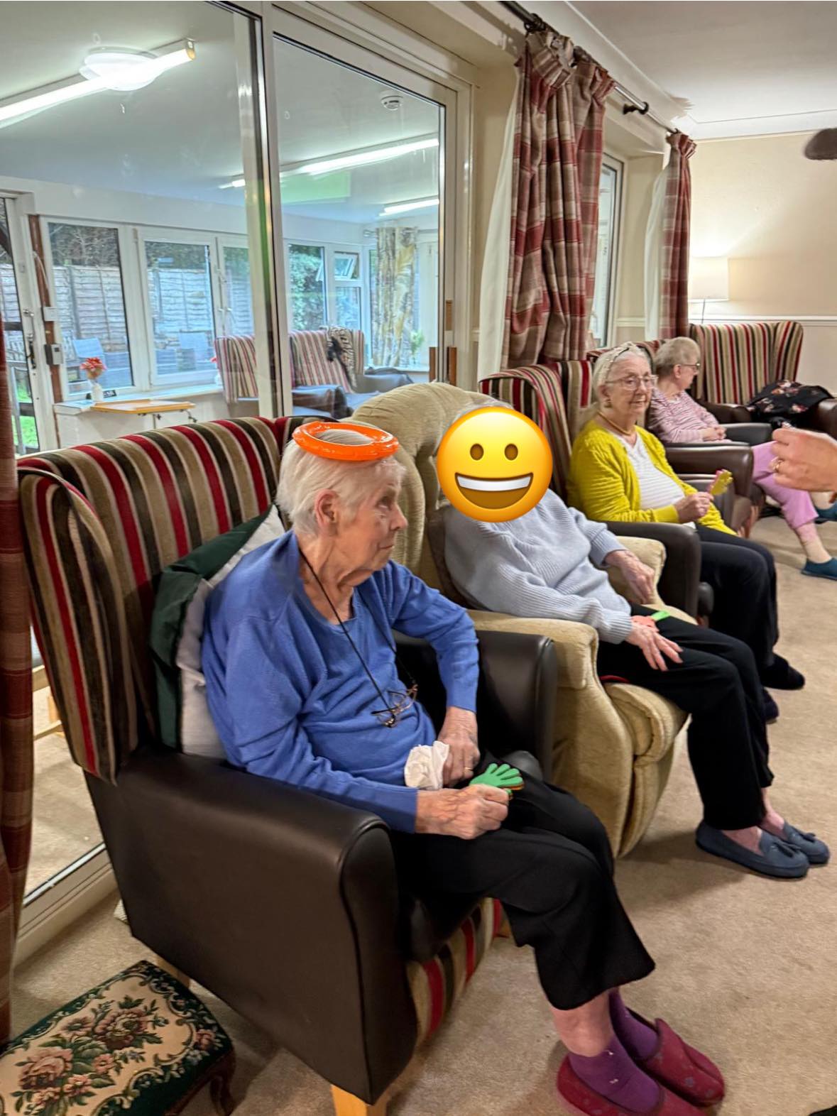 Seniors seated during group activity with props