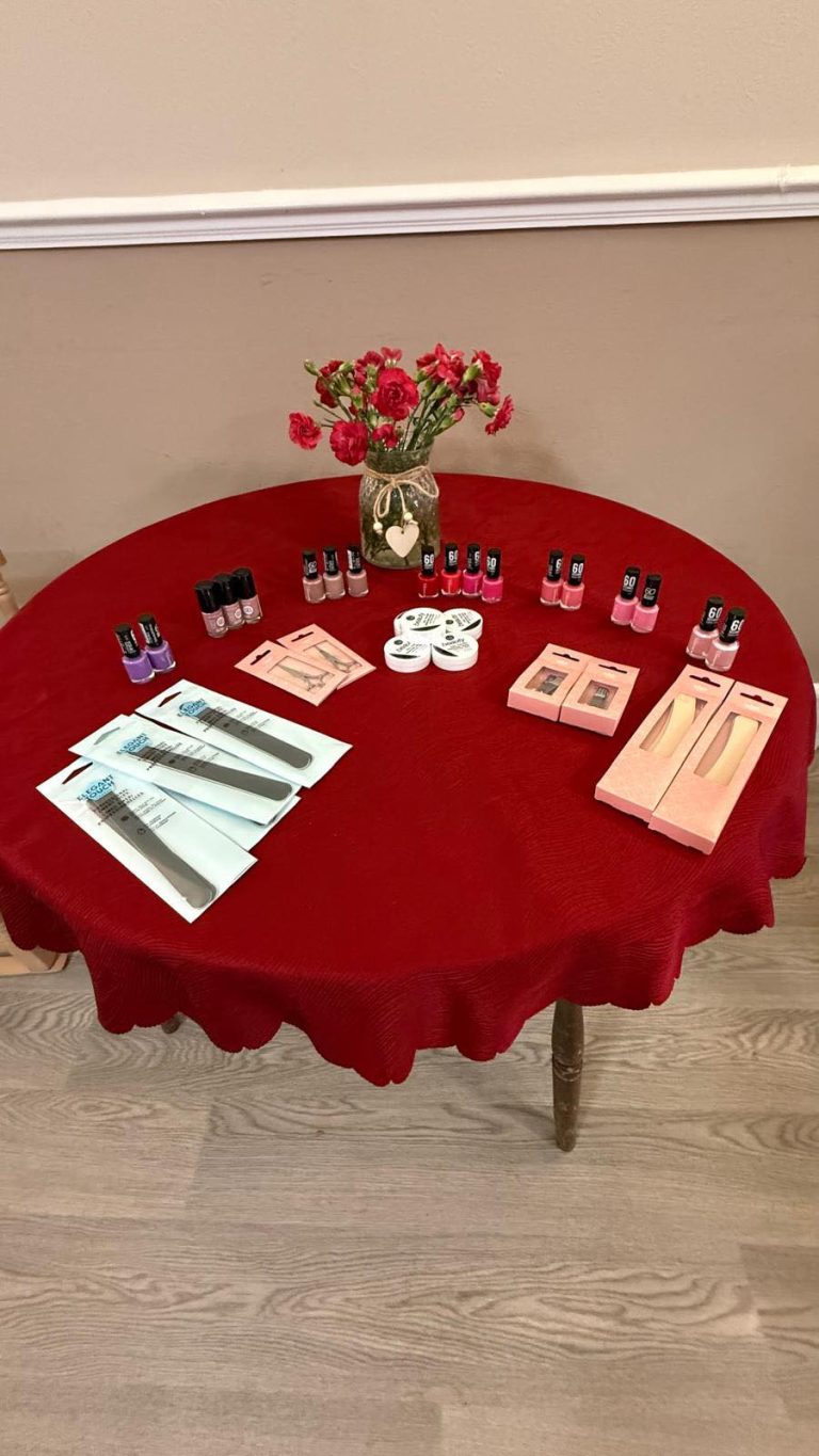 Table set up with nail care items including polish, files, and manicure kits