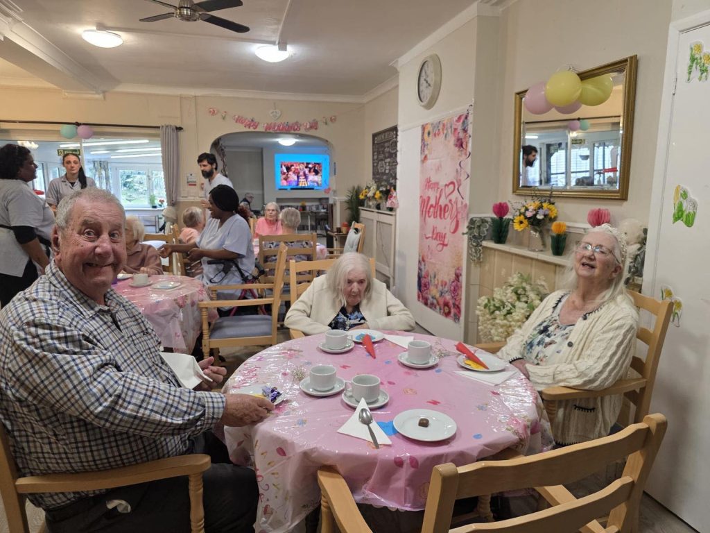 Seniors enjoying a Mother’s Day tea with caregivers