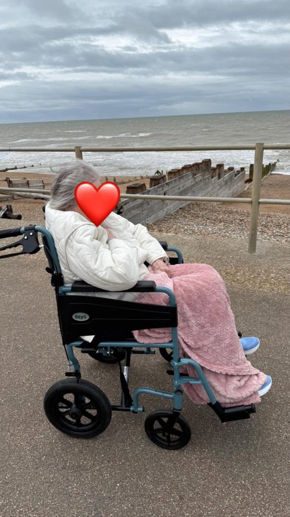 Resident relaxing by the seafront, enjoying fresh sea air and coastal views.