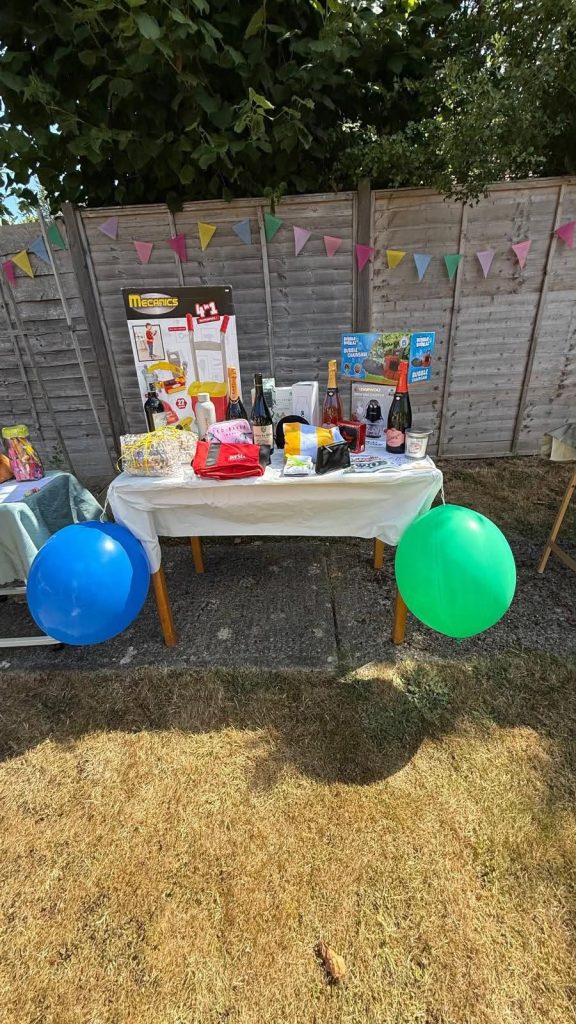 Raffle prize table at a care home summer event