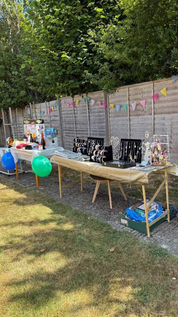 Jewellery and raffle stalls at a community garden fete