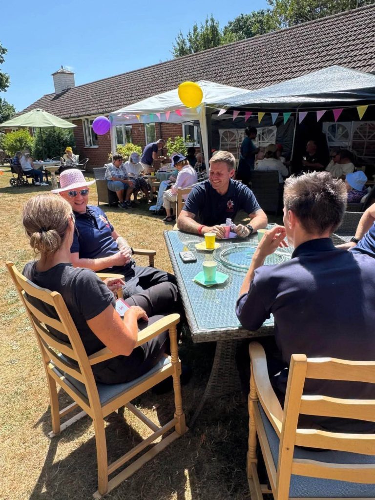 Guests enjoying the care home summer garden party