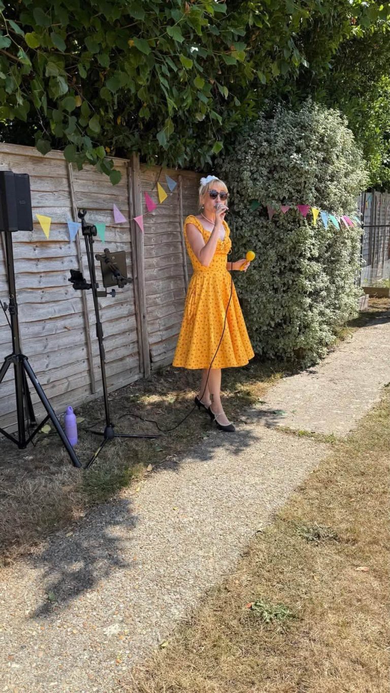 Singer entertaining guests at the garden event